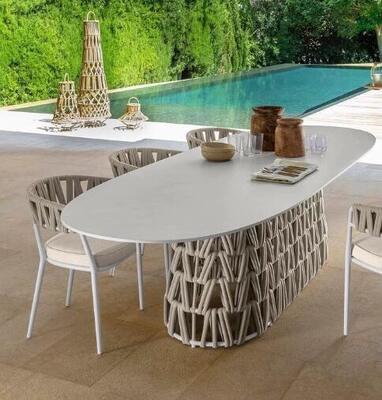 Outdoor table and chair made with weather resistant UV resistant rattan/rope and aluminum frame built for gardens courtyards and villas