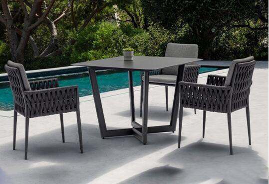 Outdoor table and 4pcs chairs made with weather resistant UV rope and aluminum frame built for gardens courtyards and villas